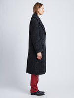 Side full length image of model wearing Melange Wool Boucle Coat in CHARCOAL