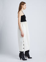 Side full length image of model wearing Viscose Crepe Knit Dress in WHITE