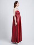 Side image of model in Nappa Leather Strapless Dress in crimson