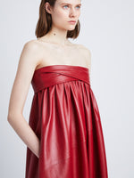 Detail image of model in Nappa Leather Strapless Dress in crimson