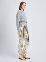 Side full length image of model wearing Metallic Leather Pants in PALE GOLD