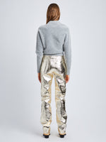Back full length image of model wearing Metallic Leather Pants in PALE GOLD