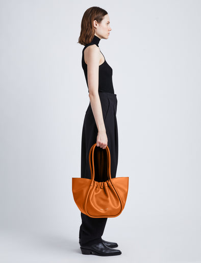 Image of model wearing Large Ruched Tote in ALMOND