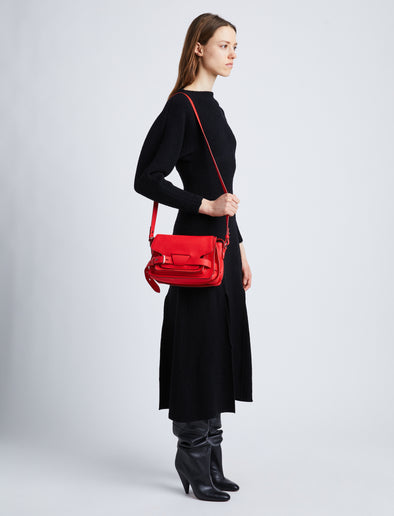 Image of model wearing Beacon Saddle Bag in ROSSO
