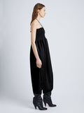 side image of model wearing viscose crepe knit dress in black