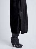 detail side image of model wearing viscose crepe knit dress in black