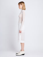 Side full length image of model wearing Viscose Gauze Knit Top in WHITE