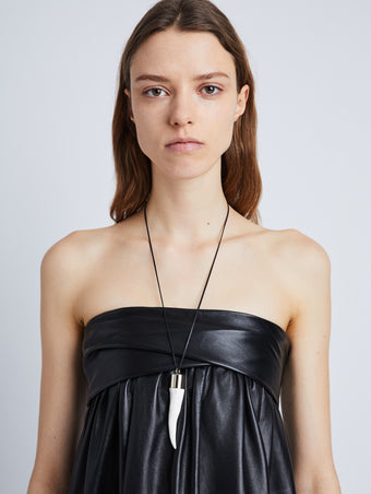 Image of model wearing Horn Necklace in WHITE/GOLD