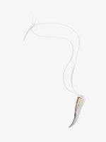 Proenza Schouler flat lay image of Horn Pendant Necklace in silver/gold