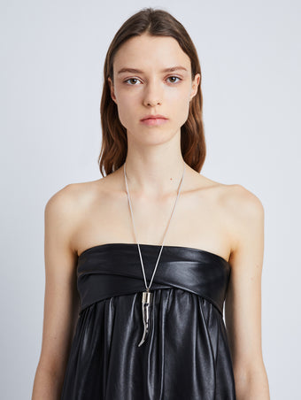 Proenza Schouler image of model wearing of Horn Pendant Necklace in silver/gold