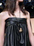 Image of model on runway wearing Enamel Horn Necklace in SILVER/GOLD