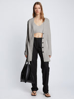 Front full length image of model wearing Ribbed Cotton Relaxed Cardigan in GREY MELANGE with belt removed