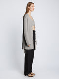 Side full length image of model wearing Ribbed Cotton Relaxed Cardigan in GREY MELANGE