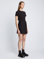 Side full length image of model wearing Tweed Wrap Skirt in BLACK
