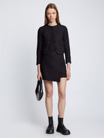 Front full length image of model wearing Tweed Wrap Skirt in BLACK with matching Tweed Jacket in BLACK