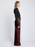 Side full length image of model wearing Cotton Twill Cargo Pants in PLUM