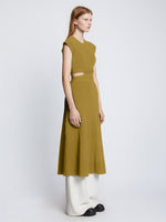 Side full length image of model wearing Pointelle Rib Cut Out Knit Dress in SULFUR