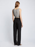 Back full length image of model wearing Ribbed Cotton Cropped Sweater in GREY MELANGE