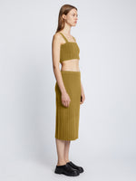 Side full length image of model wearing Pointelle Rib Knit Skirt in SULFUR
