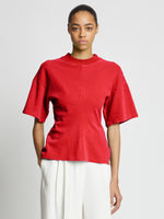 Front cropped image of model wearing Eco Cotton Waisted T-Shirt in POPPY