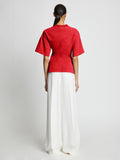 Back full length image of model wearing Eco Cotton Waisted T-Shirt in POPPY