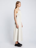 Side full length image of model wearing Drapey Suiting Cut Out Dress in OFF WHITE