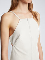 Detail image of model wearing Drapey Suiting Cut Out Dress in OFF WHITE