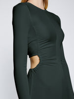 Detail image of model wearing Long Sleeve Jersey Open Back Dress in PINE