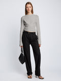 Front full length image of model wearing Ribbed Cotton Wrap Sweater in GREY MELANGE with straps tied around waist