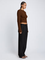 Side full length image of model wearing Ribbed Cotton Wrap Sweater in ESPRESSO