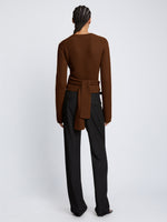 Back full length image of model wearing Ribbed Cotton Wrap Sweater in ESPRESSO