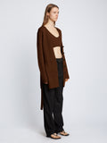 Side full length image of model wearing Ribbed Cotton Relaxed Cardigan in ESPRESSO