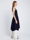 Side full length image of model wearing Barre Bustier Dress in NAVY