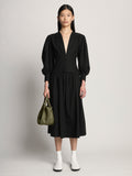 Image of model carrying Small Ruched Crossbody Tote in OLIVE in hand