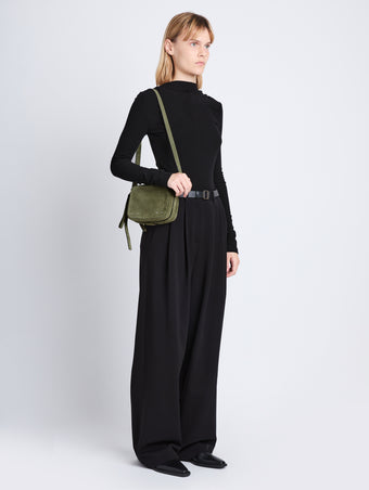 Image of model wearing Suede Watts Camera Bag in BAMBOO