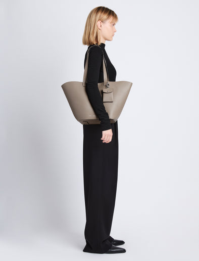 Image of model wearing Large Bedford Tote In Leather in clay