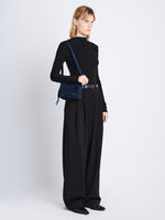 Image of model wearing Suede Watts Camera Bag in NAVY