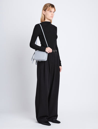 Image of model wearing Watts Camera Bag in ASH