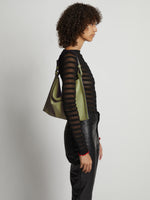 Image of model wearing Minetta Bag In Suede in bamboo