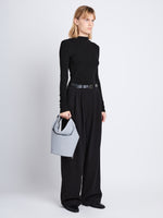 Image of model wearing Spring Bag In Leather in ash in hand