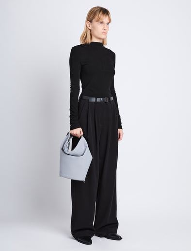 Image of model wearing Spring Bag In Leather in ash in hand