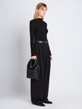 Image of model wearing  image of Spring Bag In Leather in black in hand