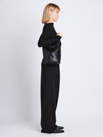 Image of model wearing  image of Spring Bag In Leather in black on shoulder