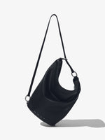 Front image of  image of Spring Bag In Leather in black worn as a sling