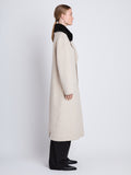 Side full length image of model wearing Emma Coat in OAT/BLACK
