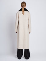 Back full length image of model wearing Emma Coat in OAT/BLACK