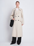 Front full length image of model wearing Emma Coat in OAT/BLACK with faux fur collar removed