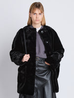 Front cropped image of model wearing Penelope Coat in BLACK