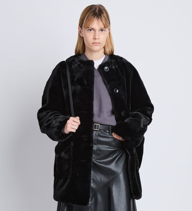 Front cropped image of model wearing Penelope Coat in BLACK