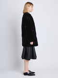 Side full length image of model wearing Penelope Coat in BLACK